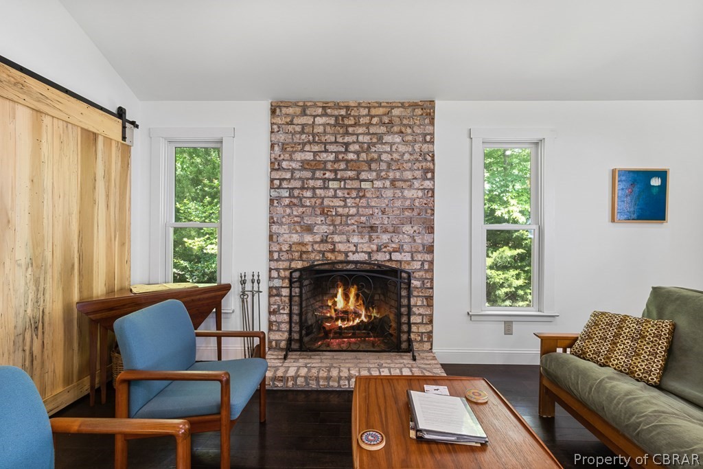 90 Bar Point Road Lancaster, VA 22503 - Photo 2 of 33 a living room with furniture and a fireplace