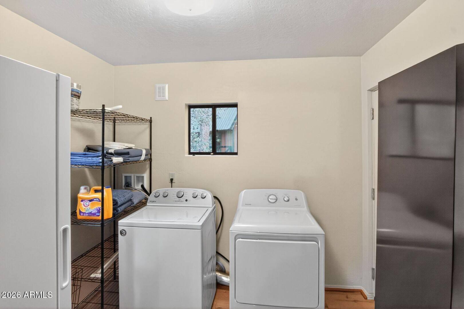 8884 Tonto Rim Drive Pine, AZ 85544 - Photo 23 of 43 a utility room with dryer and washer