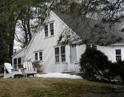370 Wilton Road Westport, CT 06880 - Photo 1 of 1 a front view of house with yard and trees in the background