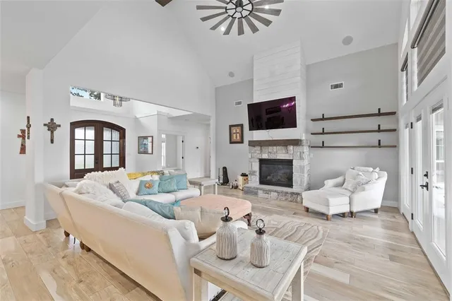 a living room with furniture fireplace and a flat screen tv