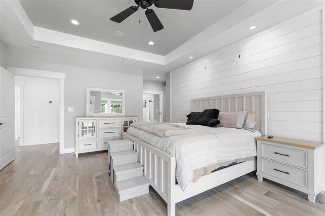 a bedroom with a bed and a dresser