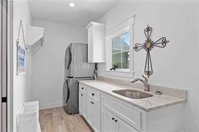 a kitchen with a sink and a refrigerator