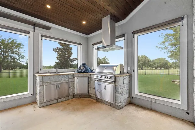 a kitchen with sink and cabinets