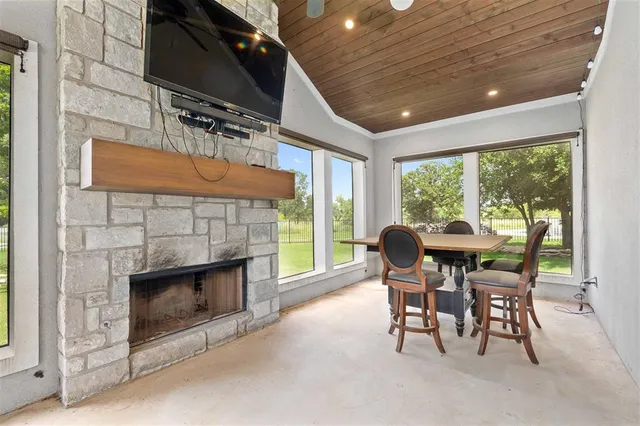 a dining room with furniture and a fireplace