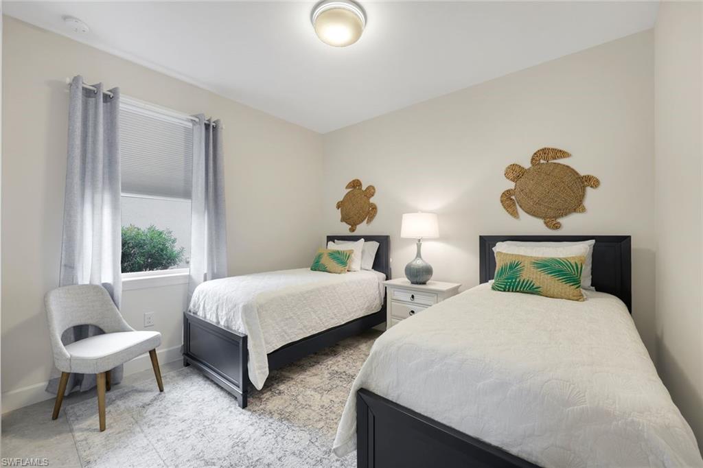 20052 Wymberly Way Estero, FL 33928 - Photo 11 of 27 a bedroom with two beds and a large window
