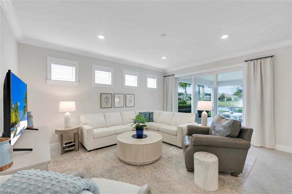 20052 Wymberly Way Estero, FL 33928 - Photo 12 of 27 a living room with furniture and a flat screen tv