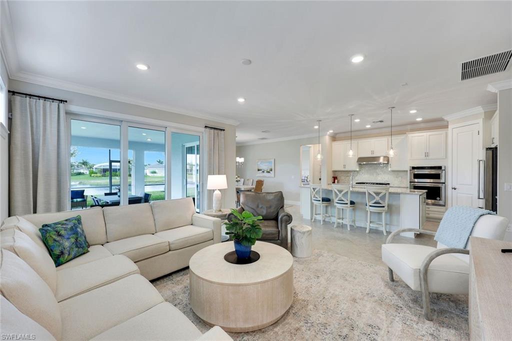 20052 Wymberly Way Estero, FL 33928 - Photo 13 of 27 a living room with furniture and a large window