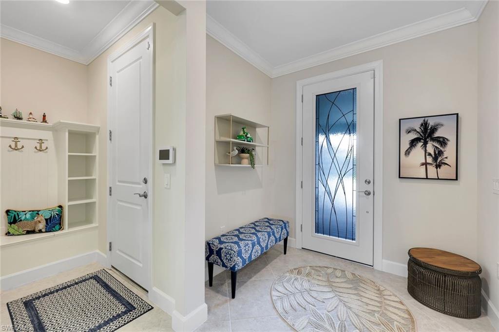 20052 Wymberly Way Estero, FL 33928 - Photo 14 of 27 a bedroom with furniture and window