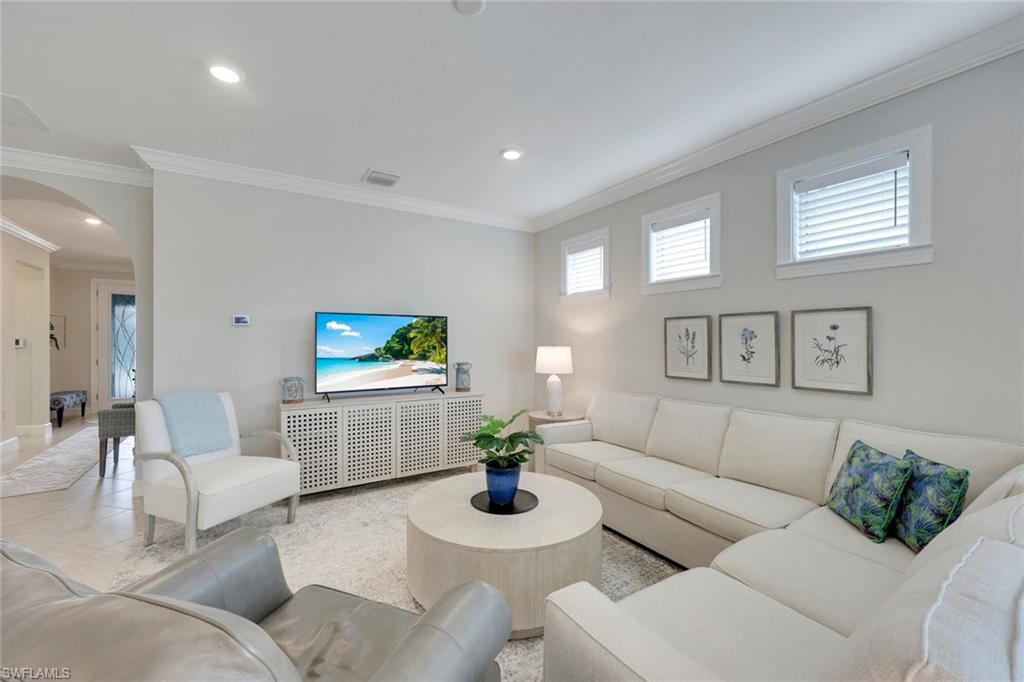 20052 Wymberly Way Estero, FL 33928 - Photo 15 of 27 a living room with furniture and a flat screen tv