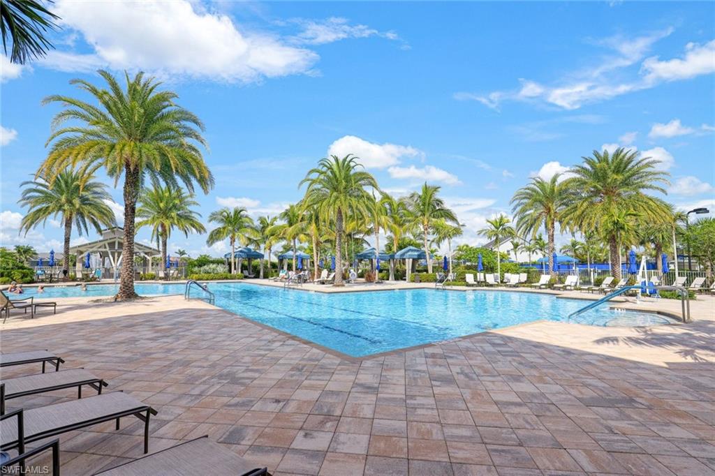 20052 Wymberly Way Estero, FL 33928 - Photo 22 of 27 a view of a swimming pool and a yard