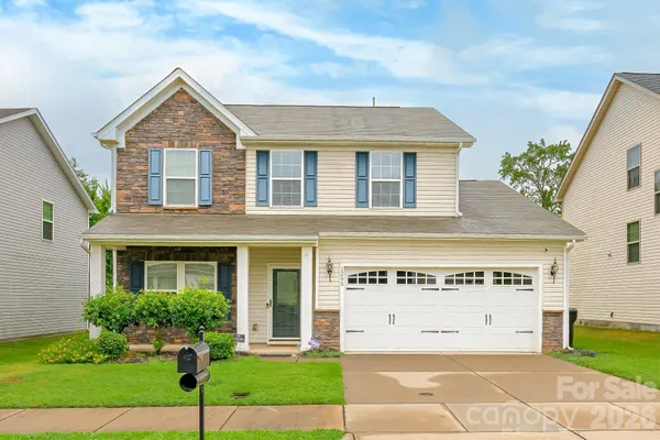 front view of a house with a yard