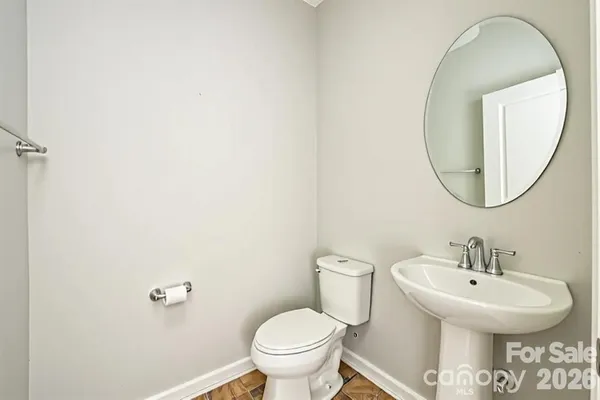 a bathroom with a toilet and a sink