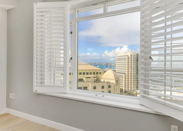 a view of a window with a flower pot on the window