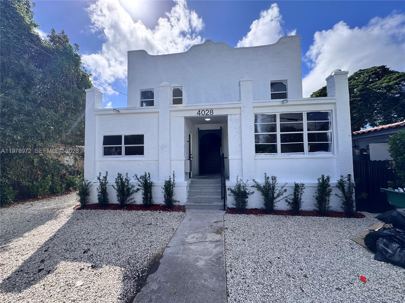 a view of a house with furniture