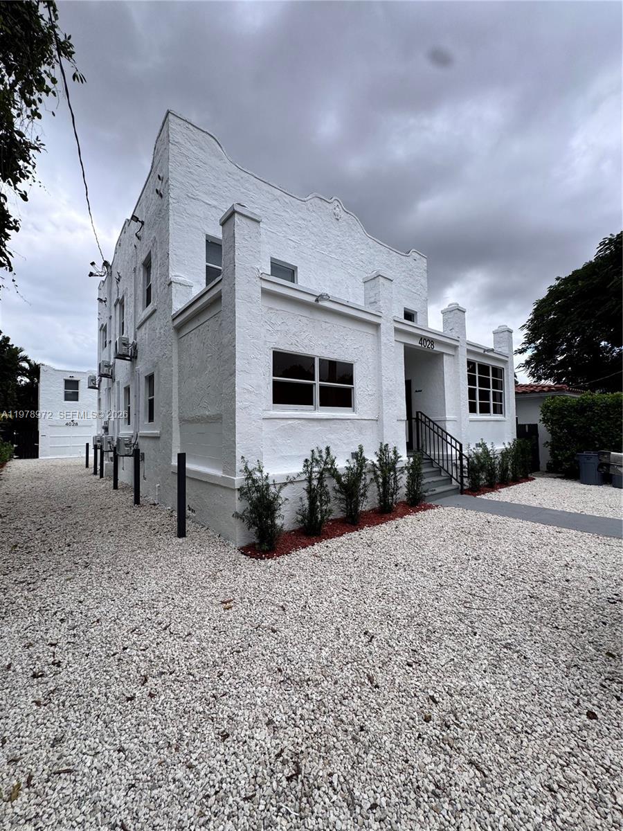 4028 Southwest 11th Street Miami, FL 33134 - Photo 2 of 17 a view of a house with a yard
