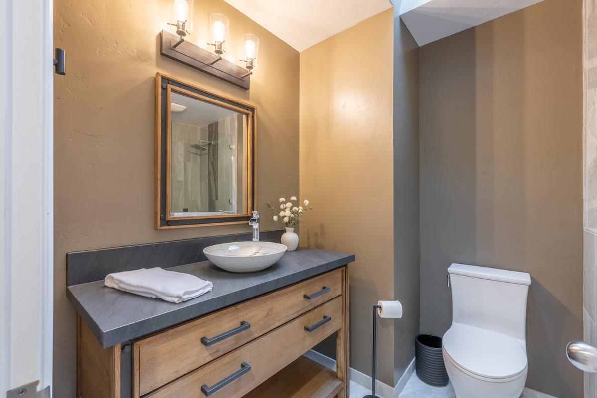 18795 Pesante Road Salinas, CA 93907 - Photo 12 of 20 a bathroom with a toilet a sink and mirror
