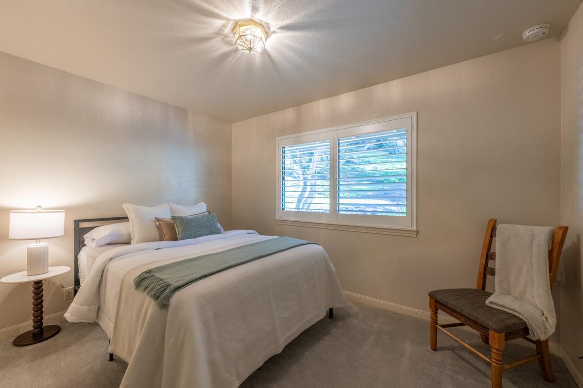 18795 Pesante Road Salinas, CA 93907 - Photo 13 of 20 a bedroom with a bed and a chair