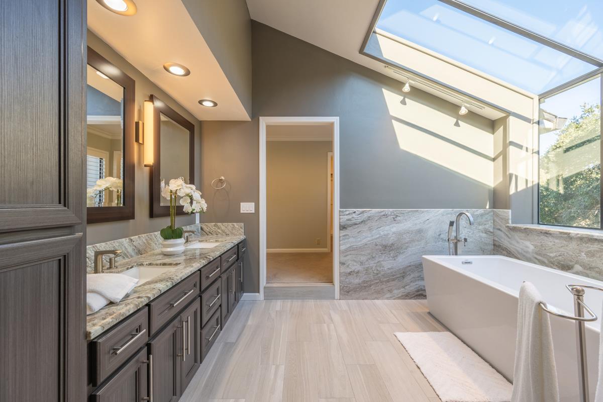 18795 Pesante Road Salinas, CA 93907 - Photo 6 of 20 a bathroom with a granite countertop double vanity sink a mirror and a bathtub