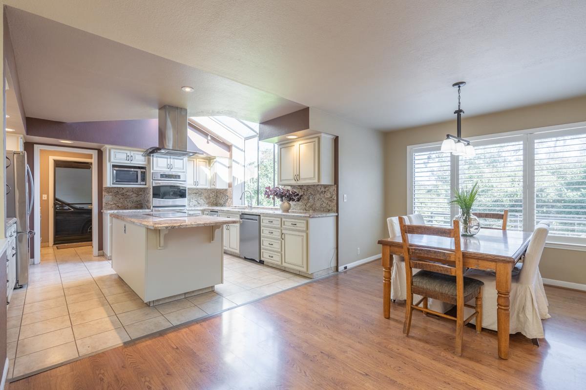 18795 Pesante Road Salinas, CA 93907 - Photo 8 of 20 a dining room kitchen counter top space a large window and stainless steel appliances