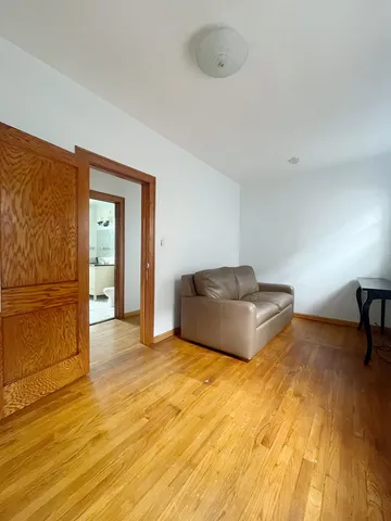 a bedroom with a bed and a table in it