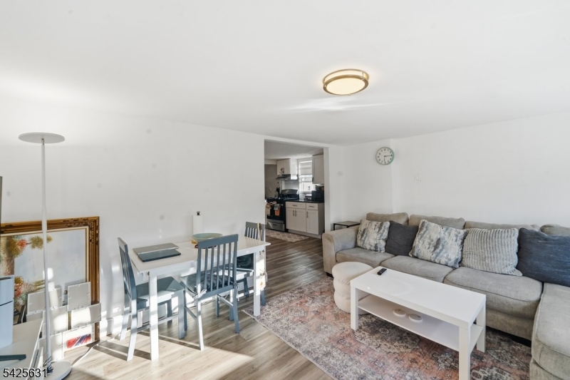 60 Westervelt Place Lodi, NJ 07644 - Photo 11 of 48 a living room with furniture and a table