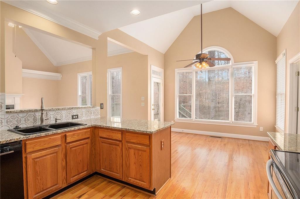 1389 Turtlebrook Lane Lawrenceville, GA 30043 - Photo 11 of 30 a view of a kitchen counter space a sink and wooden floor