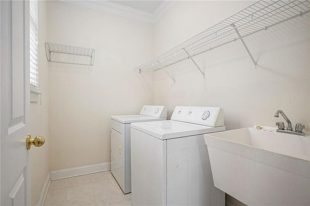 1389 Turtlebrook Lane Lawrenceville, GA 30043 - Photo 20 of 30 a utility room with dryer and washer