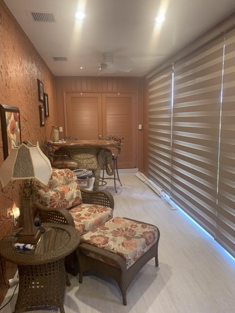 123 Lake Gloria Drive West Palm Beach, FL 33411 - Photo 12 of 25 a living room with furniture and a flat screen tv