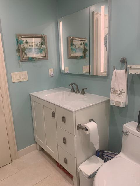 123 Lake Gloria Drive West Palm Beach, FL 33411 - Photo 15 of 25 a bathroom with a sink mirror and toilet