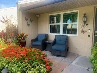 a outdoor space with a couch and potted plant