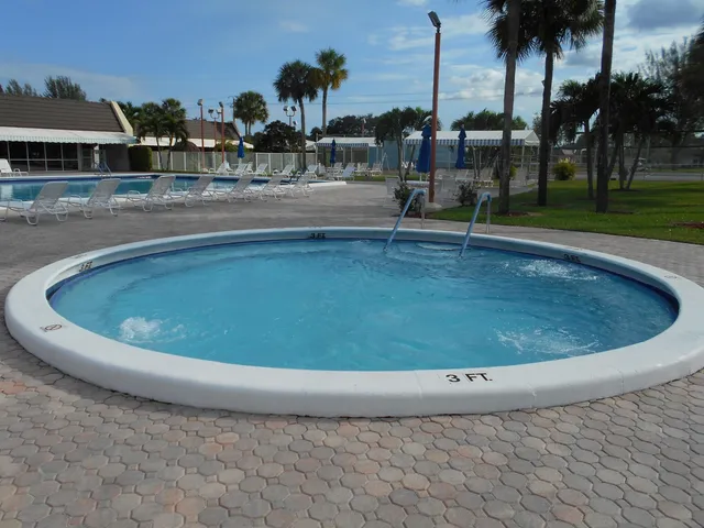 a view of a swimming pool with a lake