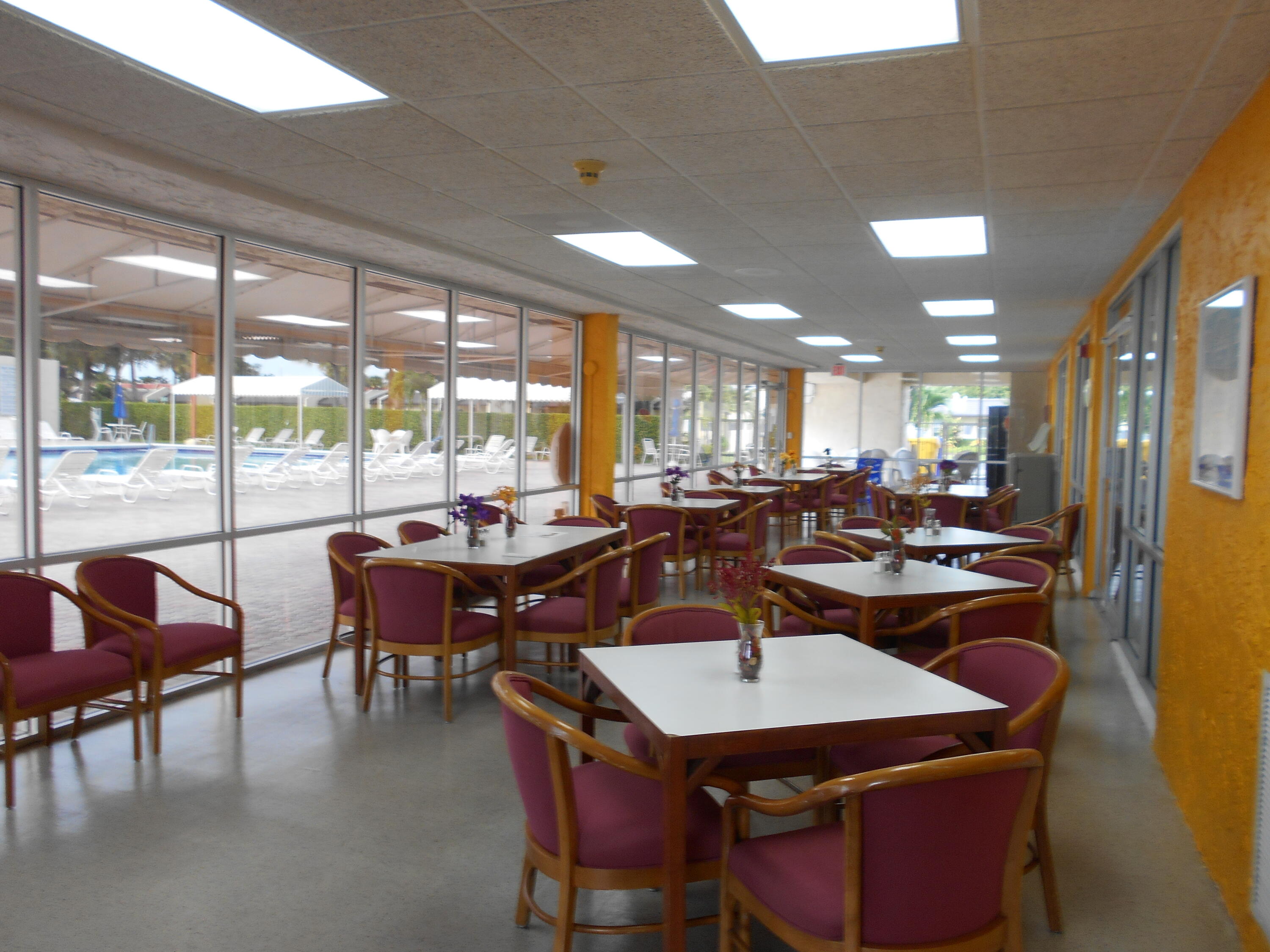 123 Lake Gloria Drive West Palm Beach, FL 33411 - Photo 25 of 25 a view of a dining room with furniture window and outside view