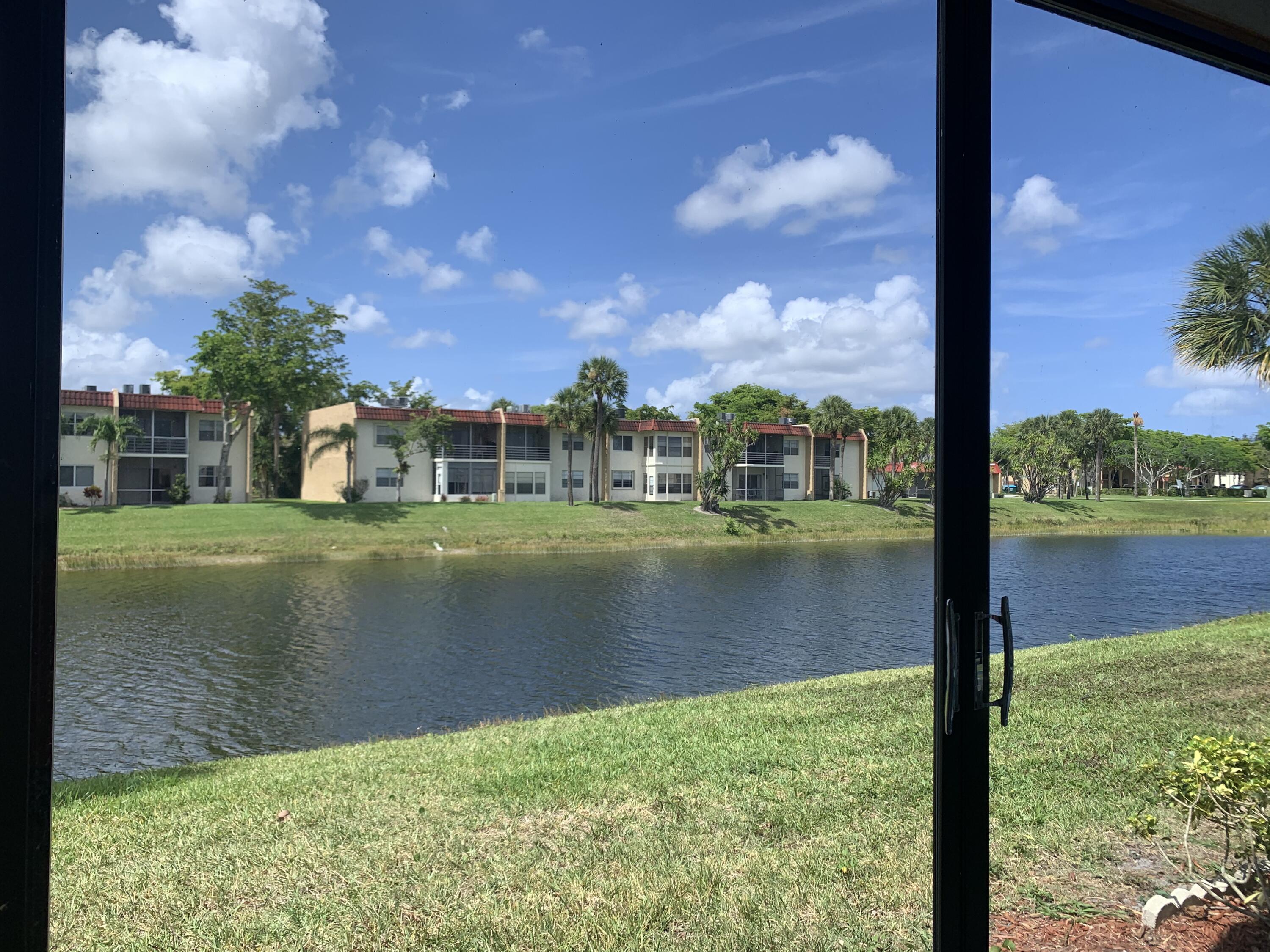 123 Lake Gloria Drive West Palm Beach, FL 33411 - Photo 4 of 25 a view of a lake from a balcony