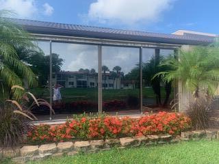 123 Lake Gloria Drive West Palm Beach, FL 33411 - Photo 5 of 25 a garden view with a potted plants