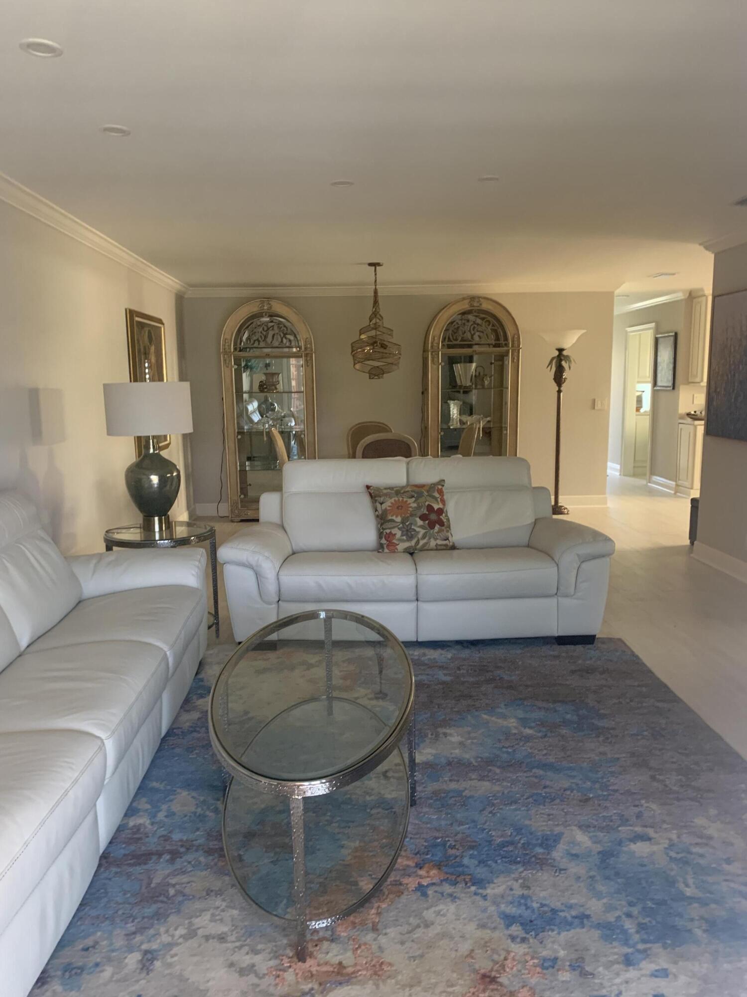 123 Lake Gloria Drive West Palm Beach, FL 33411 - Photo 10 of 25 a living room with furniture and a fireplace