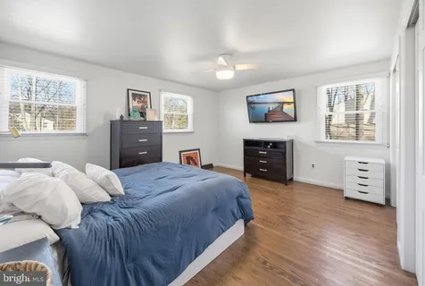 a bedroom with a bed and a tv