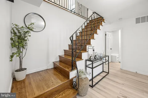 a view of entryway with wooden floor