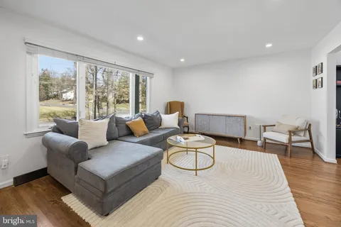 a living room with furniture and a table