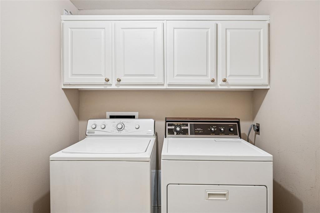 5200 Keller Springs Road, Unit 110 Dallas, TX 75248 - Photo 15 of 28 a utility room with dryer and washer