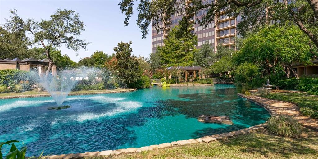 5200 Keller Springs Road, Unit 110 Dallas, TX 75248 - Photo 25 of 28 a view of a lake with a yard