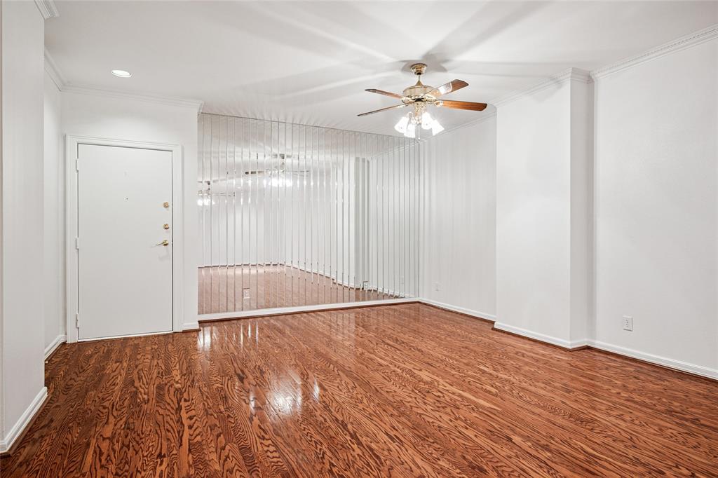 5200 Keller Springs Road, Unit 110 Dallas, TX 75248 - Photo 4 of 28 a view of an empty room with wooden floor