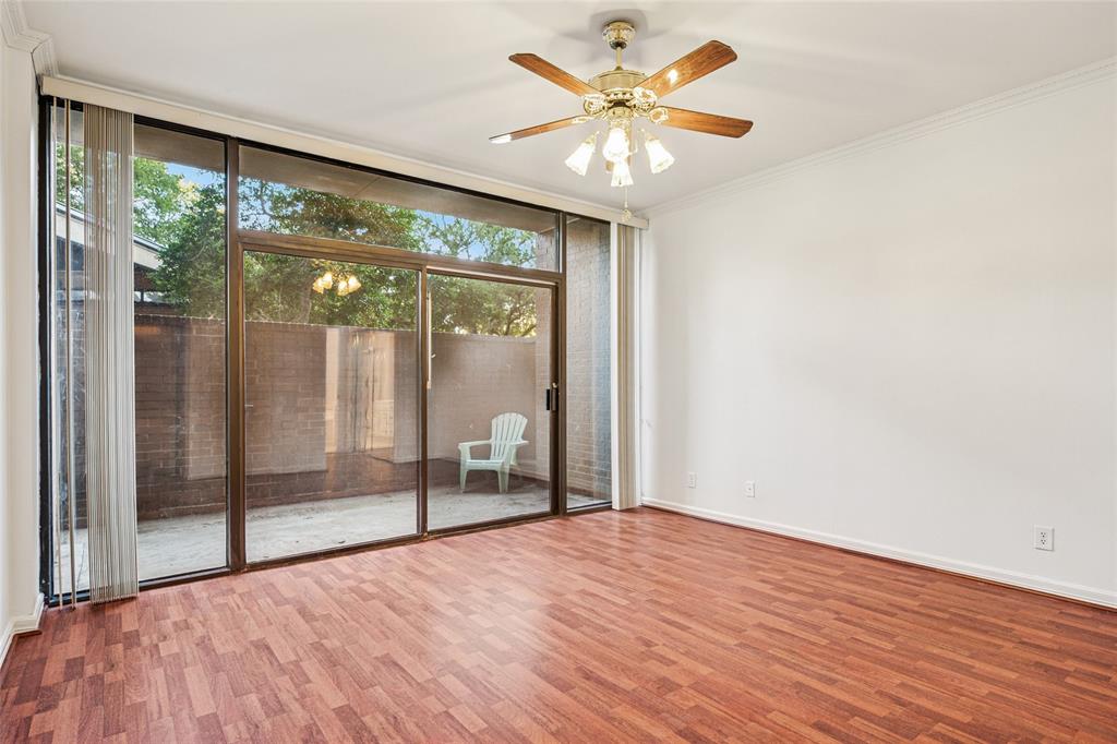 5200 Keller Springs Road, Unit 110 Dallas, TX 75248 - Photo 7 of 28 a view of an empty room with a window