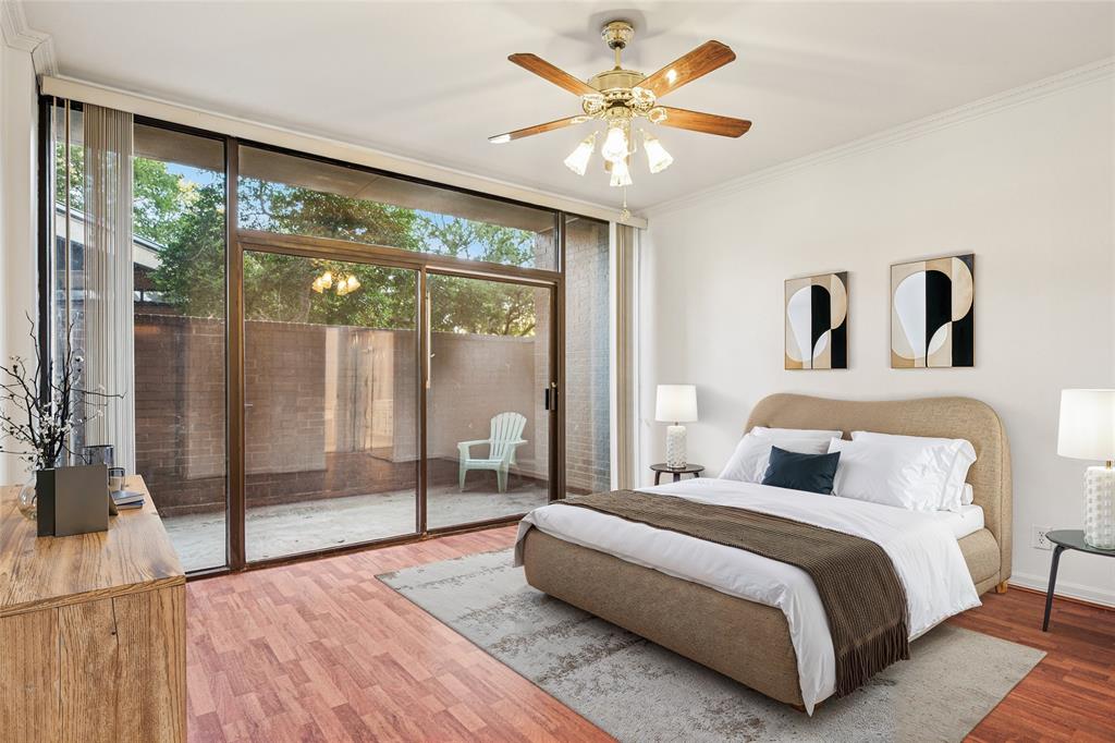 5200 Keller Springs Road, Unit 110 Dallas, TX 75248 - Photo 8 of 28 a bedroom with a large bed and a large window