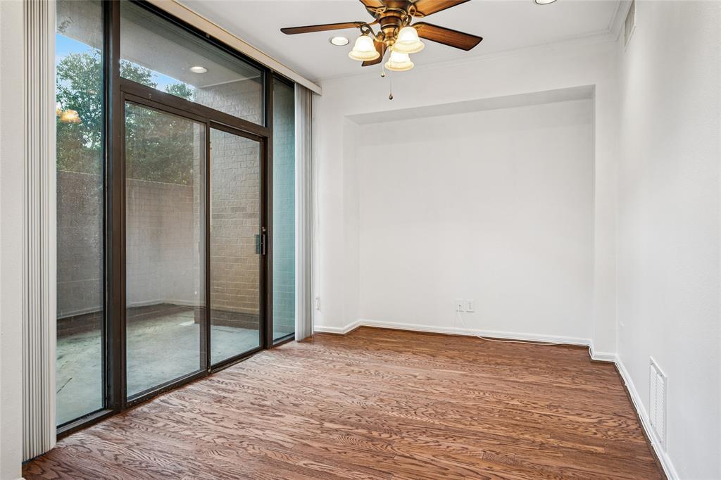 5200 Keller Springs Road, Unit 110 Dallas, TX 75248 - Photo 9 of 28 a view of a room with a ceiling fan and window