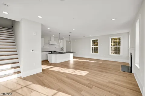 a view of kitchen with wooden floor and windows