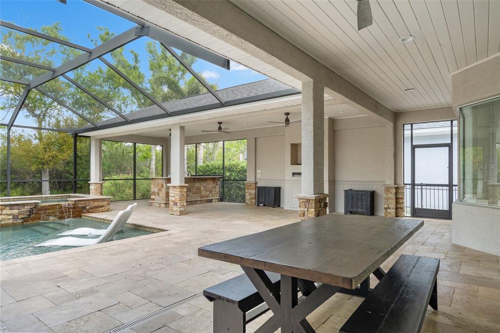 11627 Renaissance View Court Tampa, FL 33626 - Photo 4 of 62 a view of a patio with table and chairs and floor to ceiling window