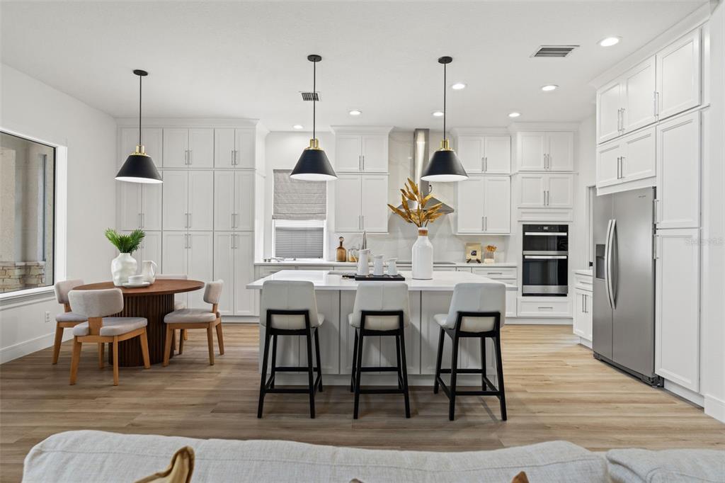 11627 Renaissance View Court Tampa, FL 33626 - Photo 44 of 62 a large kitchen with a table and chairs
