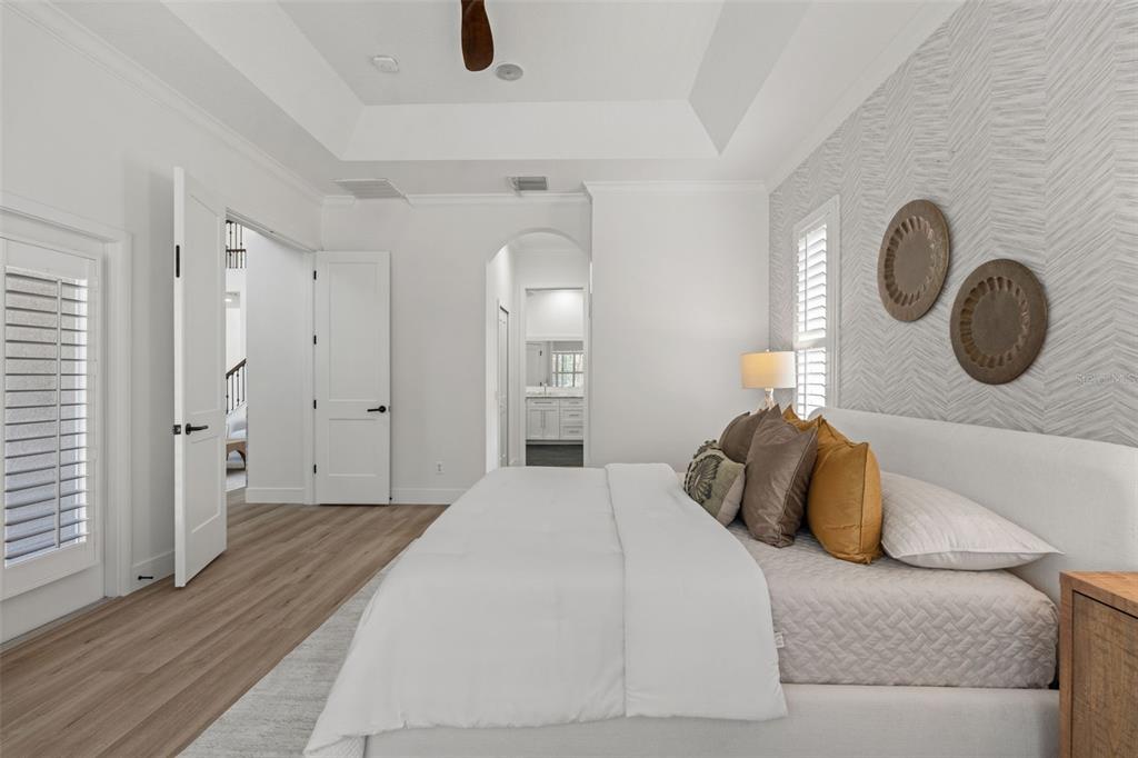 11627 Renaissance View Court Tampa, FL 33626 - Photo 49 of 62 a bedroom with a bed and a chandelier