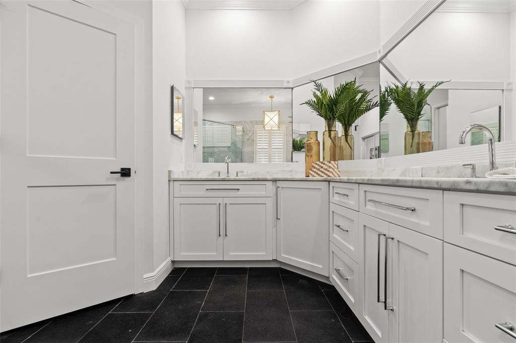 11627 Renaissance View Court Tampa, FL 33626 - Photo 51 of 62 a en suite bathroom with a granite countertop sink and a mirror