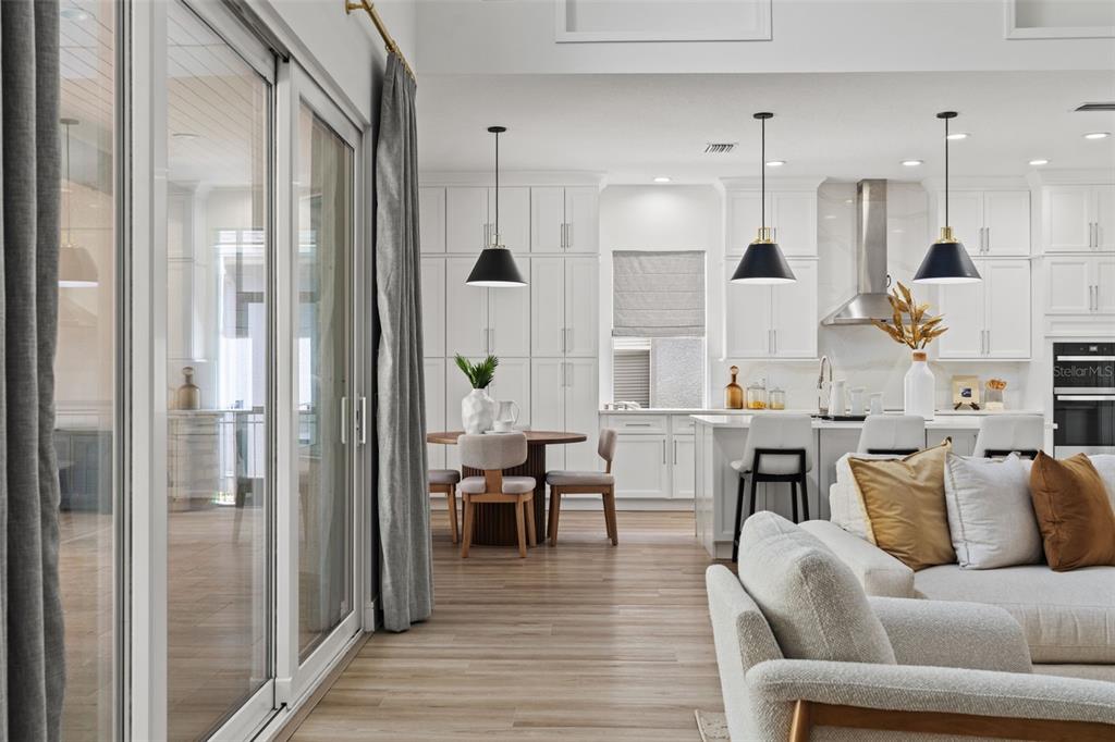 11627 Renaissance View Court Tampa, FL 33626 - Photo 54 of 62 a living room with furniture kitchen view and a wooden floor